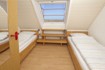 Zweites Schlafzimmer mit getrennten Betten